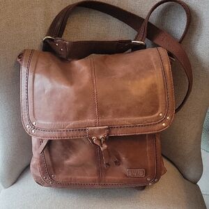 Brown Leather Messenger Bag or a backpack by the Sak